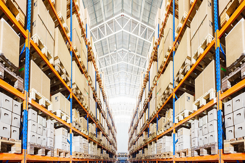 Shelves stacked with boxes highlighting the need for excess inventory management.